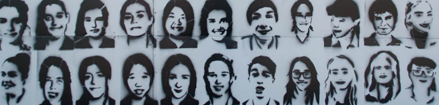 Black stenciled faces of children on a white background